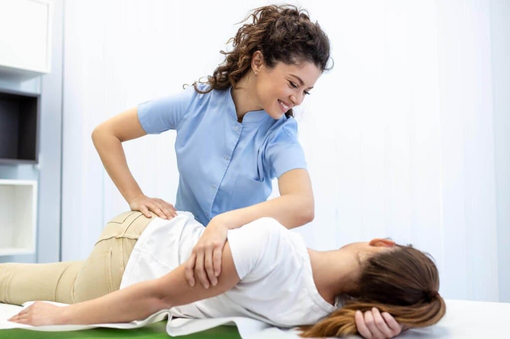 Chiropractor adjusting a patient, representing RWS roots in chiropractic business development